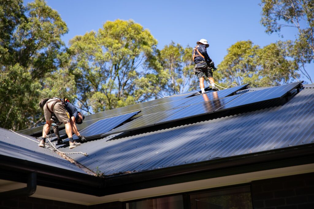 A two-person crew working across a long roof line, Newcastle, Maitland & Lake Macquarie