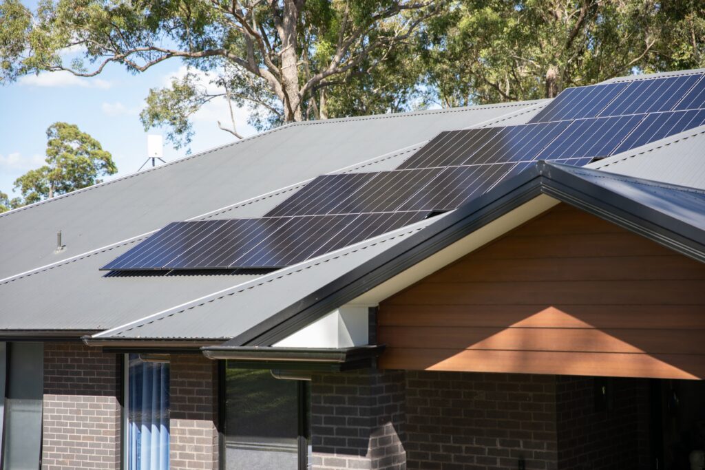 A finished array on a gabled roof among gum trees, the Central Coast