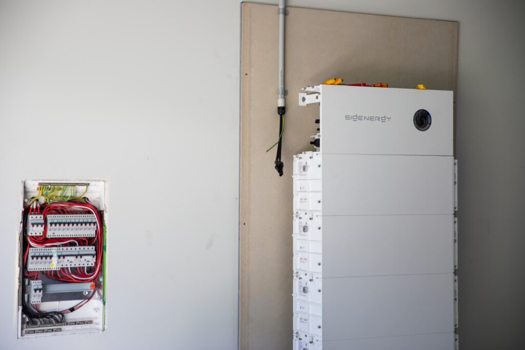 What size battery do I need? A stacked Sigenergy SigenStor battery installed beside a switchboard
